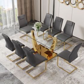 Table and chair set.Modern rectangular dining table with Transparent tempered glass tabletop and gold plated metal legs.Paried with 8 comfortable chai